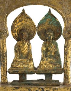 detail of two buddhas side by side