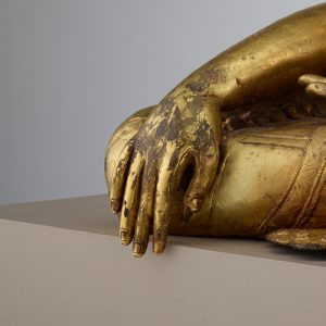 detail, showing hand of sculpture touching the ground
