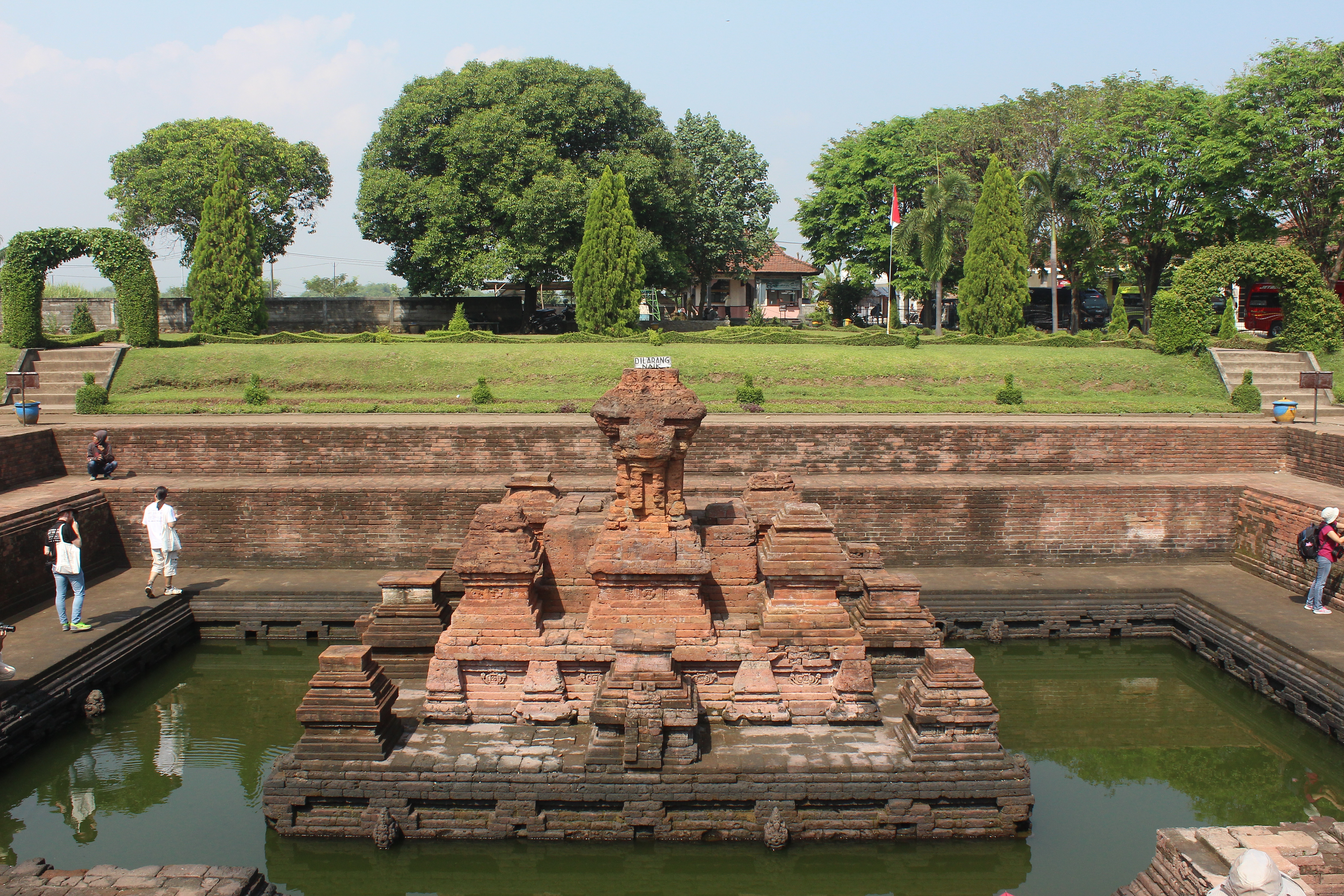 Brick temple in a below-groundlevel pool