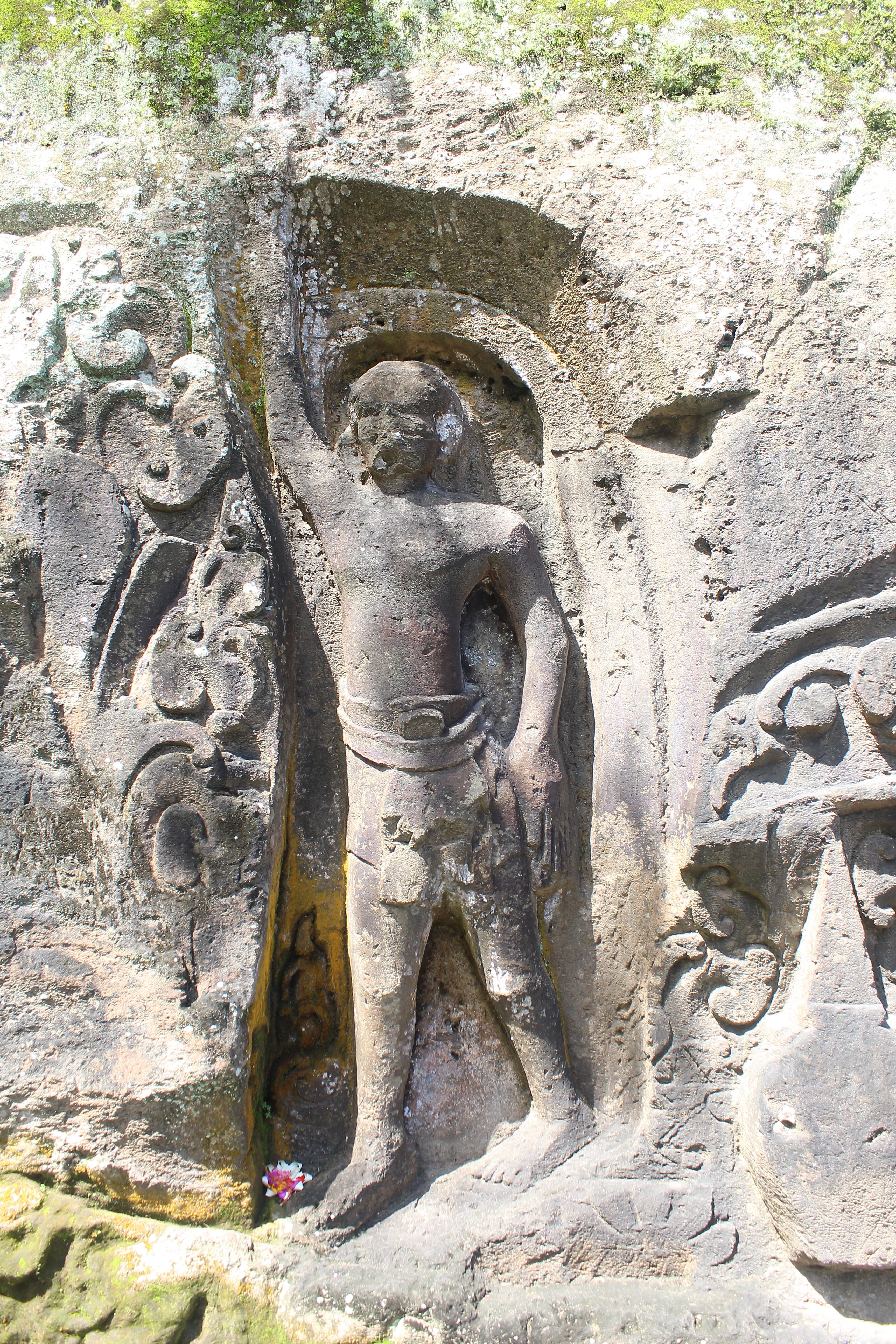 Relief showing man holding up his arm