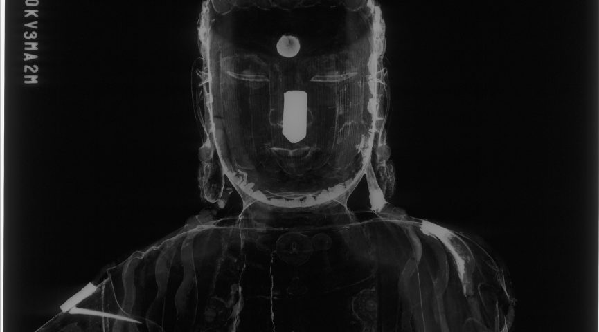 X-ray of the front view of the head of the sculpture, showing construction details and an object inside the head