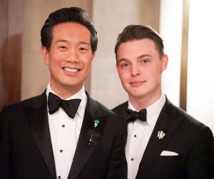 Dr. Cheng and Mr. Harrell wearing tuxedos with black bow-ties, smiling.