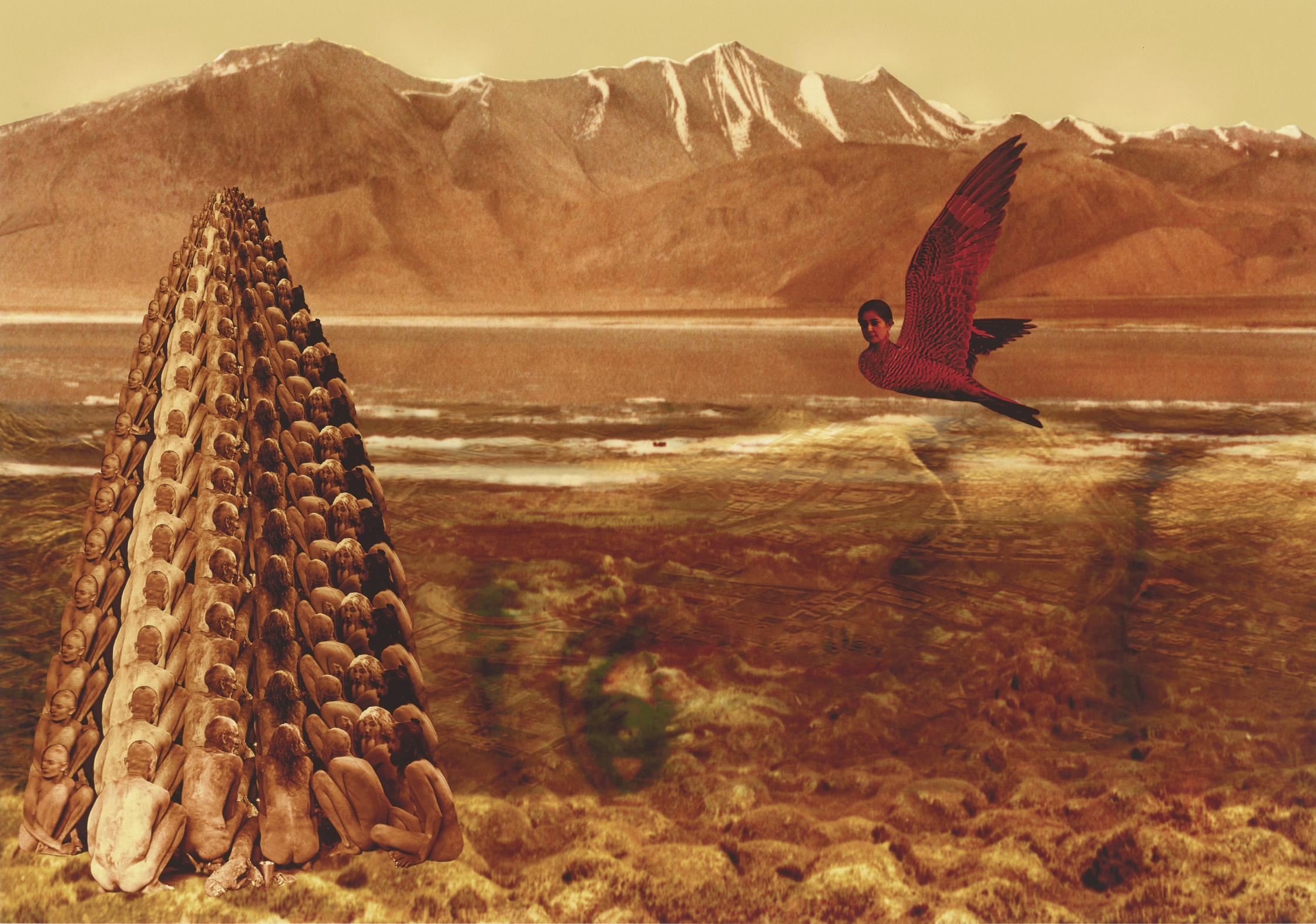 In a digitally constructed image is a rusty orange desert landscape with mountains in the background. On the left, dozens of nude figures are assembled in the formation of a tall tower. On the right is a red creature with the body of a bird and the head of a woman. In the foreground, the semitransparent image of a woman’s face is superimposed sideways across the terrain.